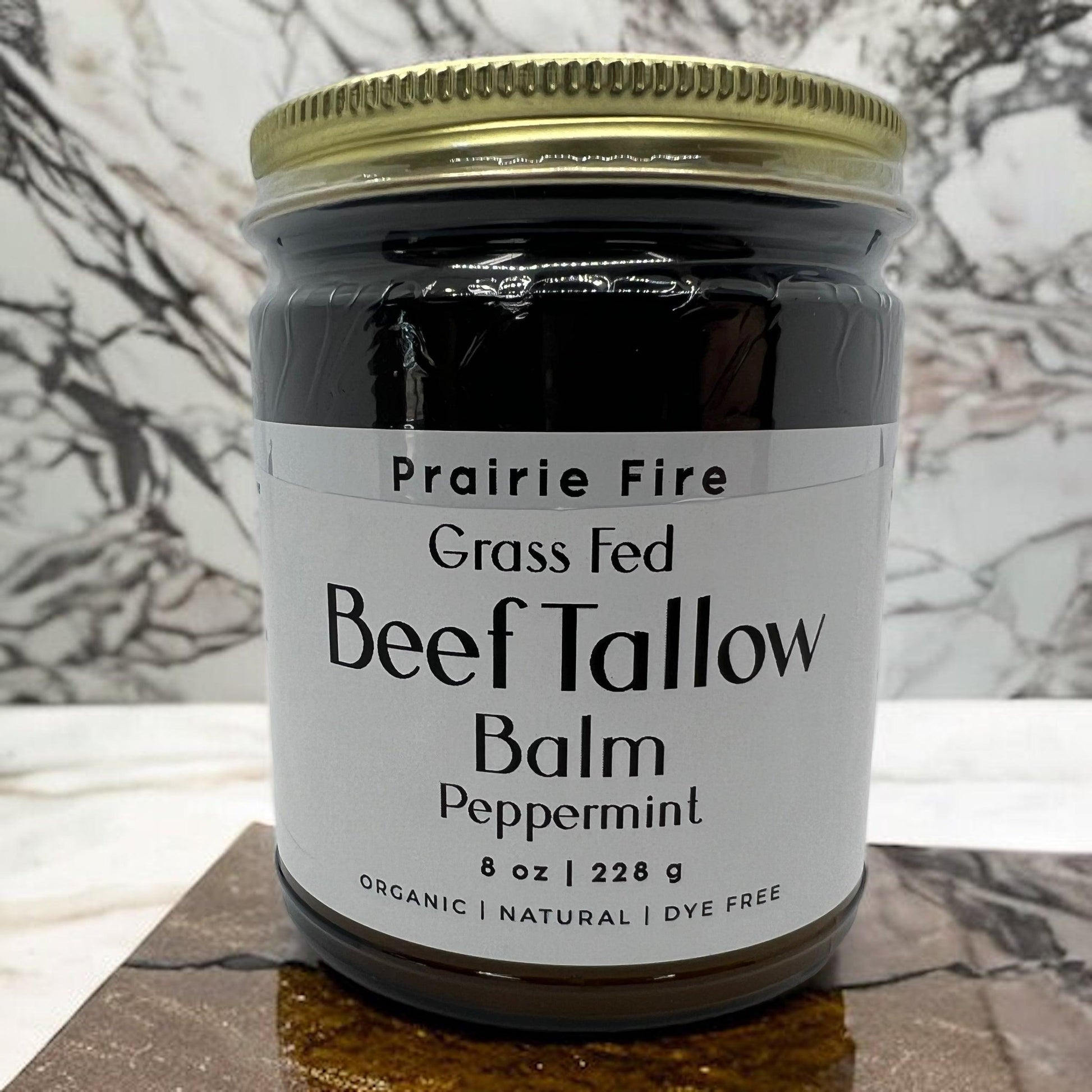 Organic beef tallow balm in 8 oz jar from Prairie Fire Tallow, a moisturizing skin care lotion made in the USA with grass-fed ingredients.