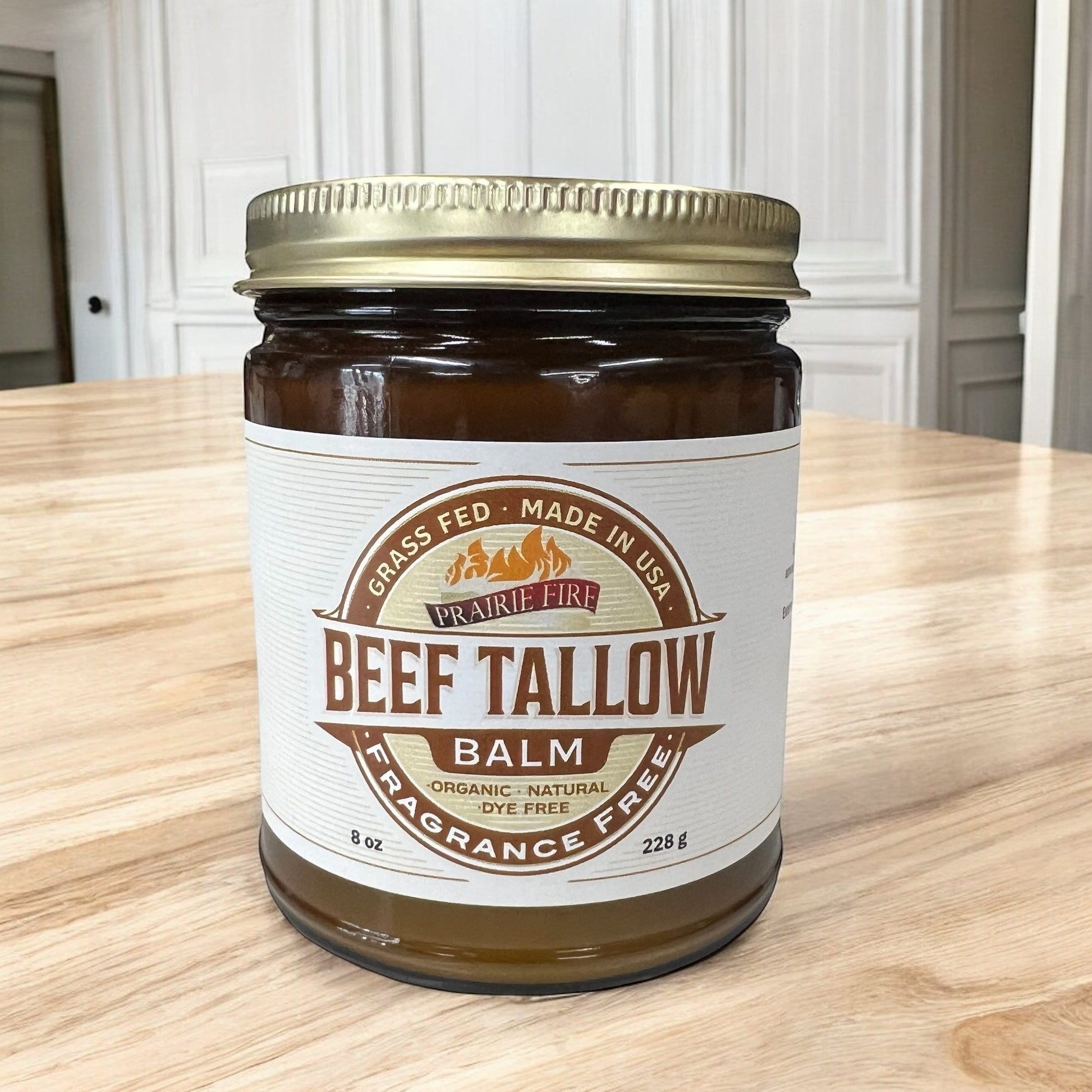 Organic beef tallow balm in a white jar, Prairie Fire Tallow moisturizer, made in USA, for nourishing, moisturizing skin care.