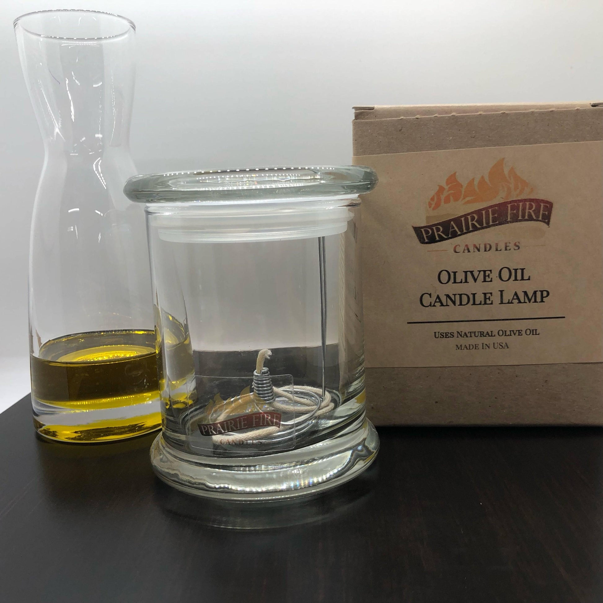 Olive oil candle lamp from Prairie Fire Tallow with lavender, used as emergency backup during power outages.