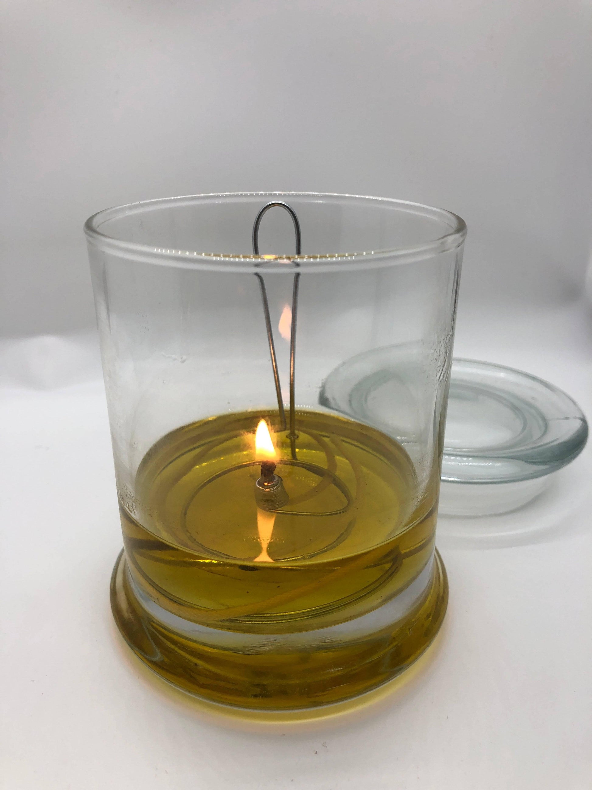 Olive Oil Candle Lamp from Prairie Fire Tallow, designed as an emergency backup for power outages, with a rustic appearance.