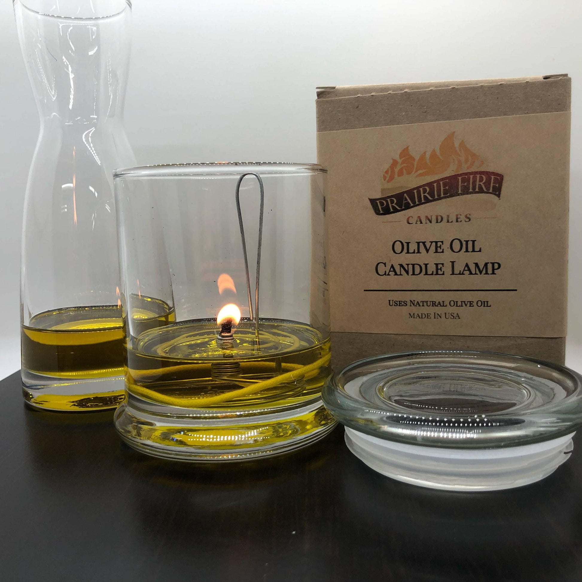 Olive Oil Candle Lamp by Prairie Fire Tallow, used as an emergency backup during power outages, with a classic design.