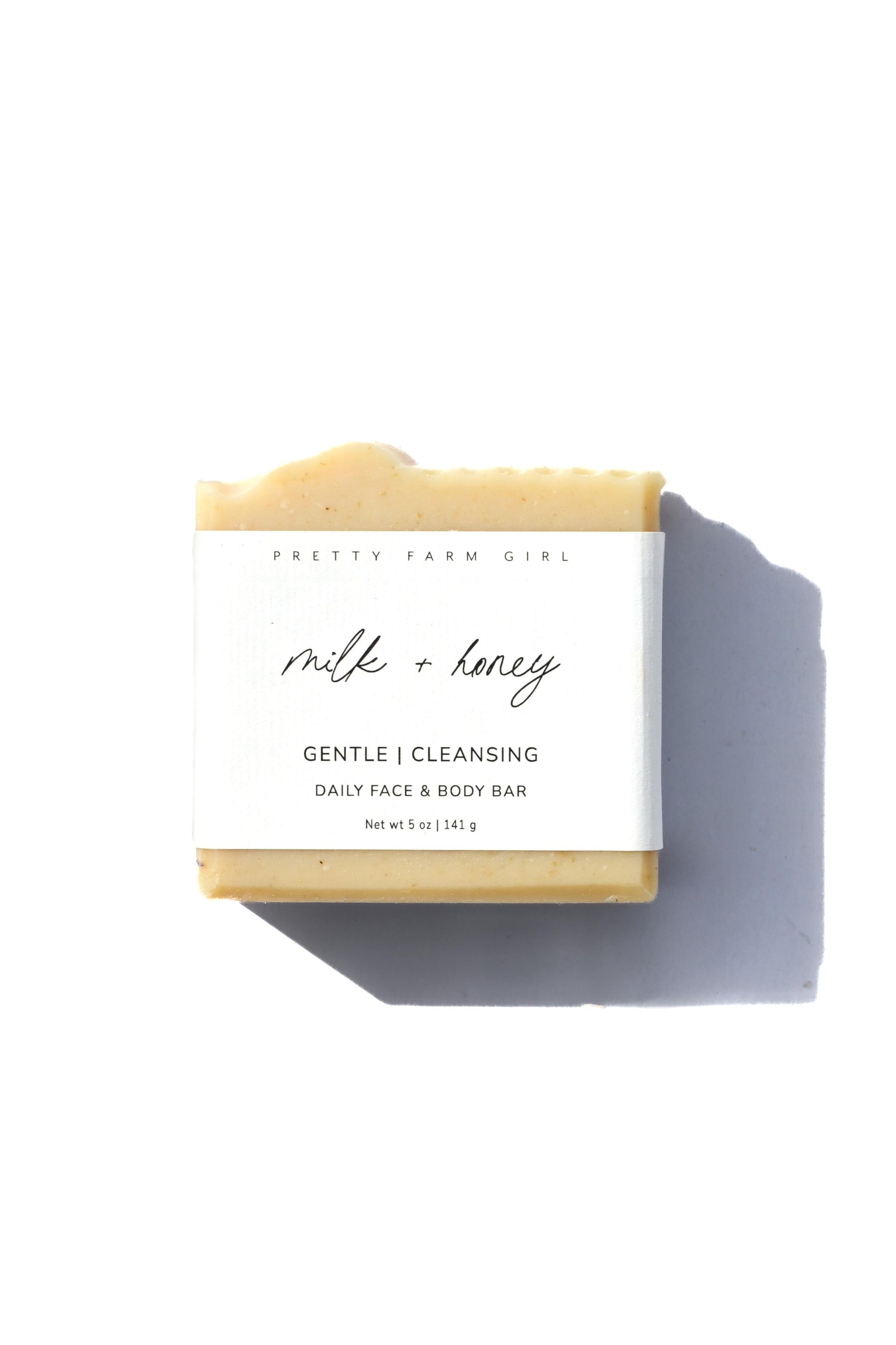 Three fragrance-free handmade soap bars by Pretty Farm Girl, featuring tallow and goat milk, displayed in a close-up image.