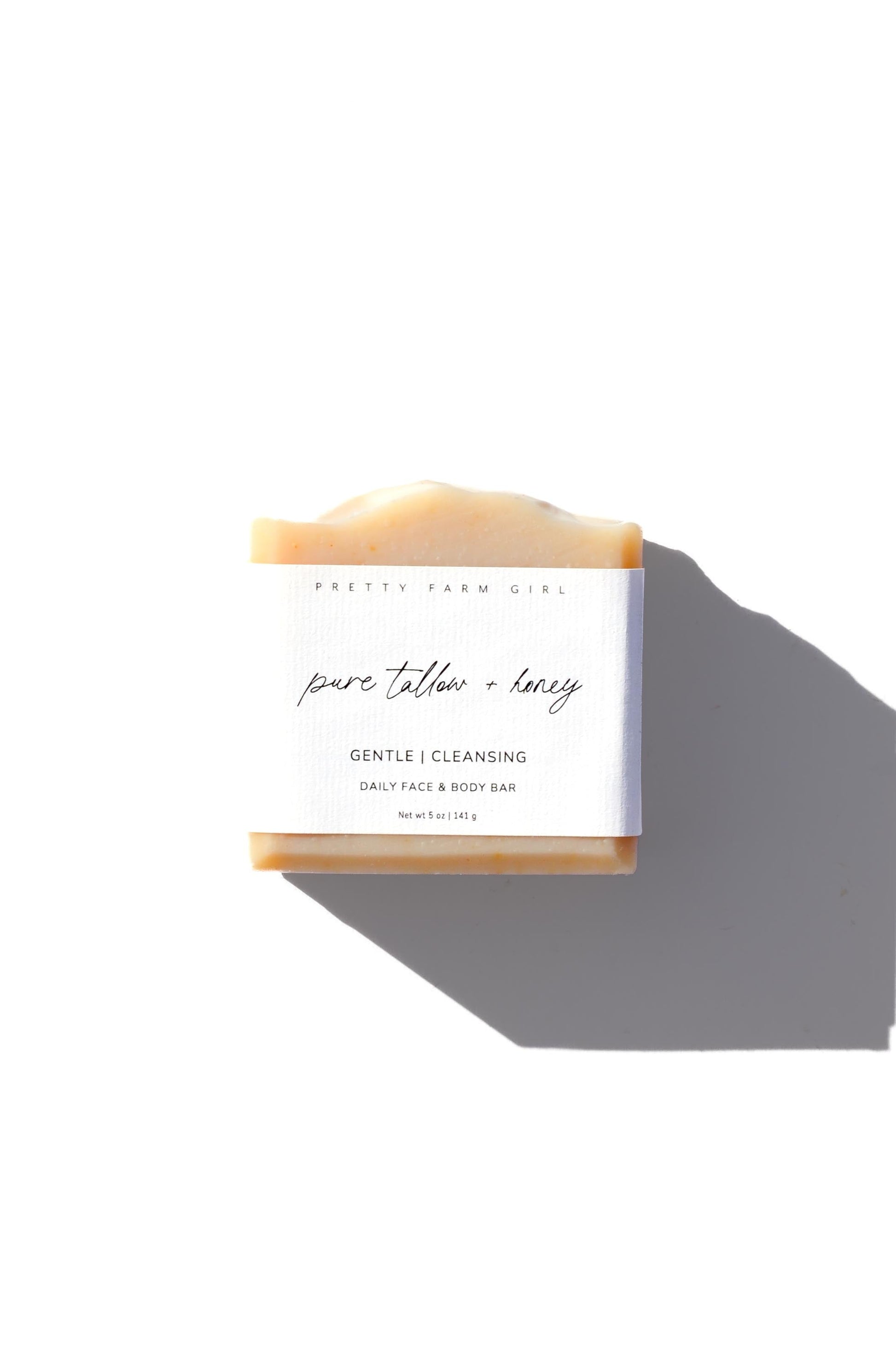 Three handmade fragrance-free soap bars with tallow and goat milk by Pretty Farm Girl, showing natural, rustic soap textures.