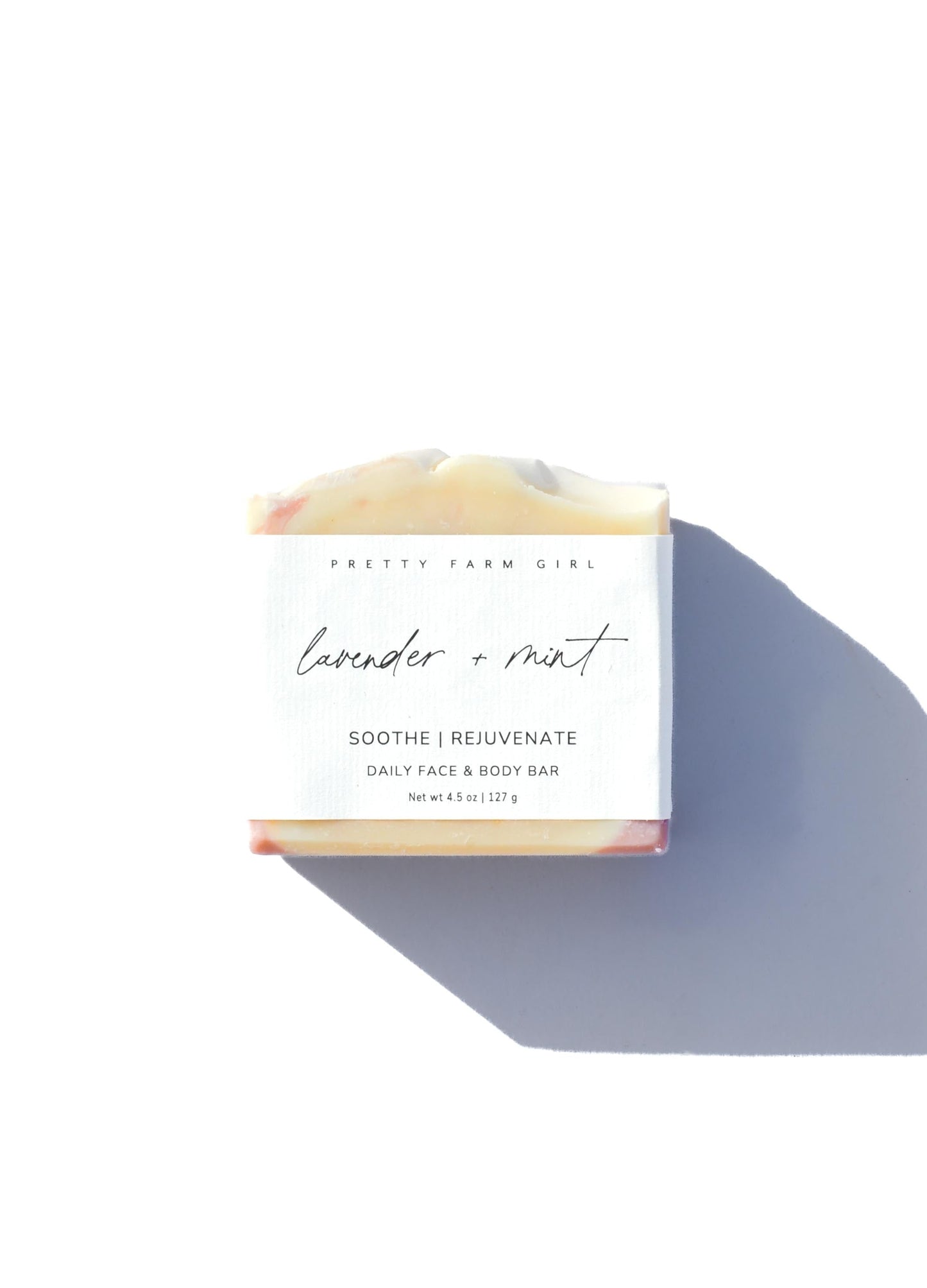 Lavender and mint handmade bar soap by Pretty Farm Girl, featuring tallow and goat milk, with a natural soap appearance and botanical elements.