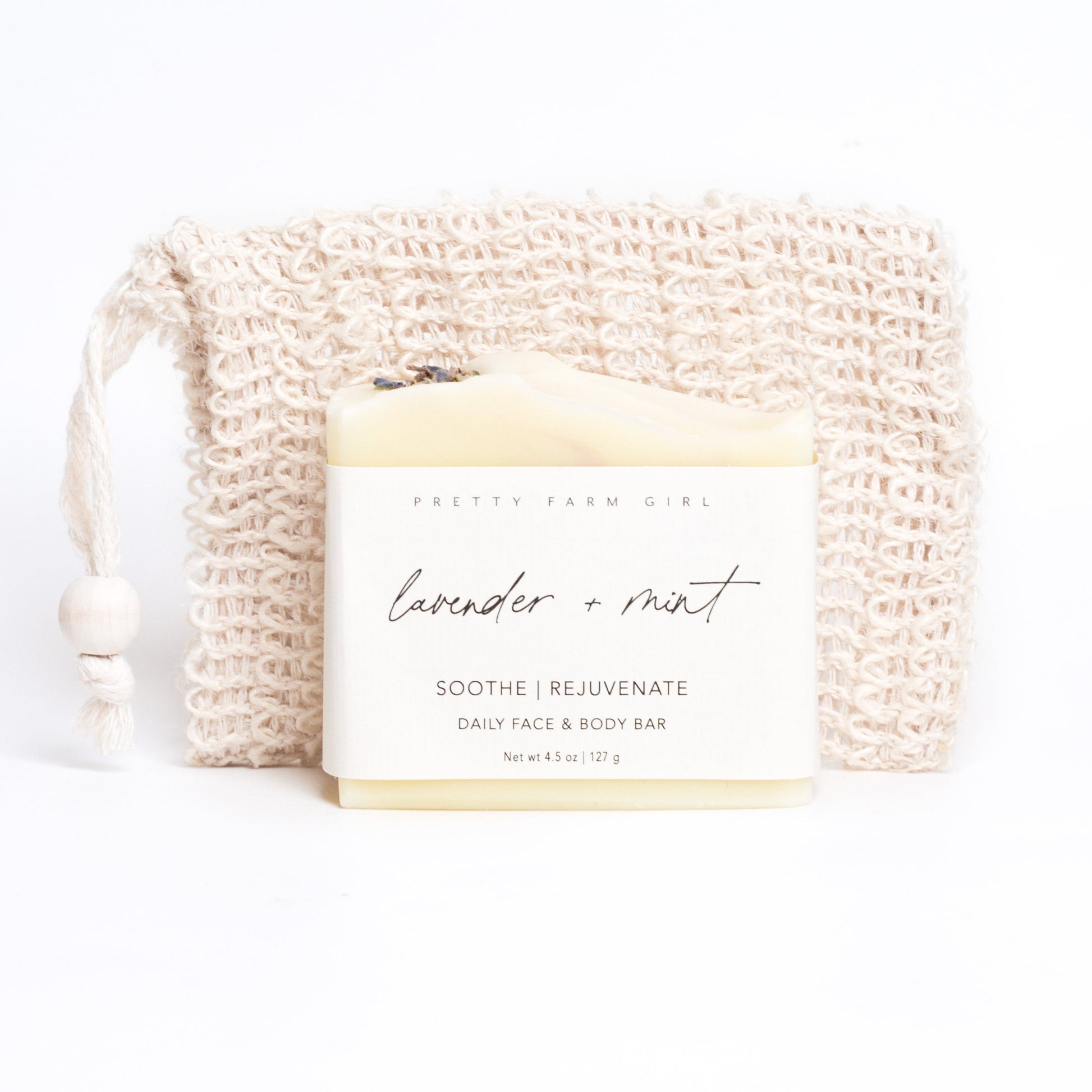 Lavender and mint handmade tallow and goat milk soap bar by Pretty Farm Girl, showing a natural soap with lavender and mint accents.