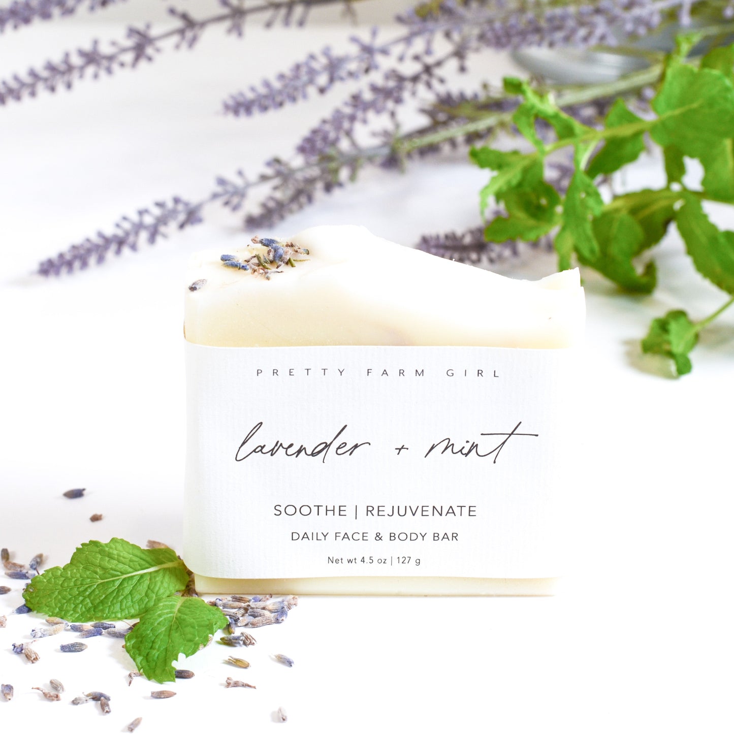 Lavender and mint handmade soap bar by Pretty Farm Girl with tallow and goat milk, showcasing a natural, textured soap surface.