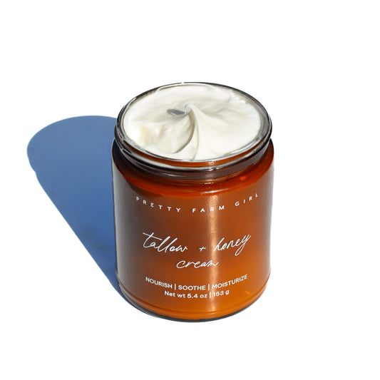 Fragrance-free tallow and honey cream for sensitive skin by Pretty Farm Girl, showing a jar of soothing skincare cream.