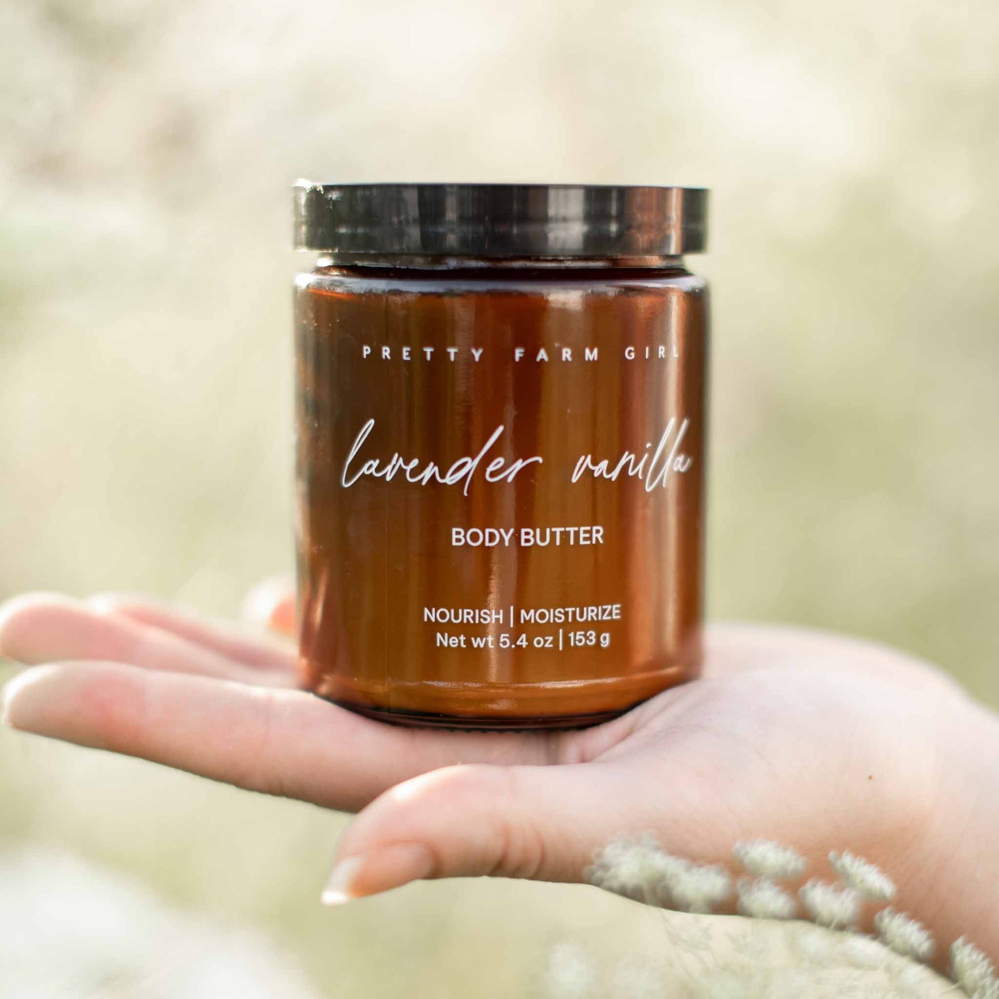 Lavender vanilla bean tallow body butter cream by Pretty Farm Girl, showing a smooth, creamy texture in a jar.