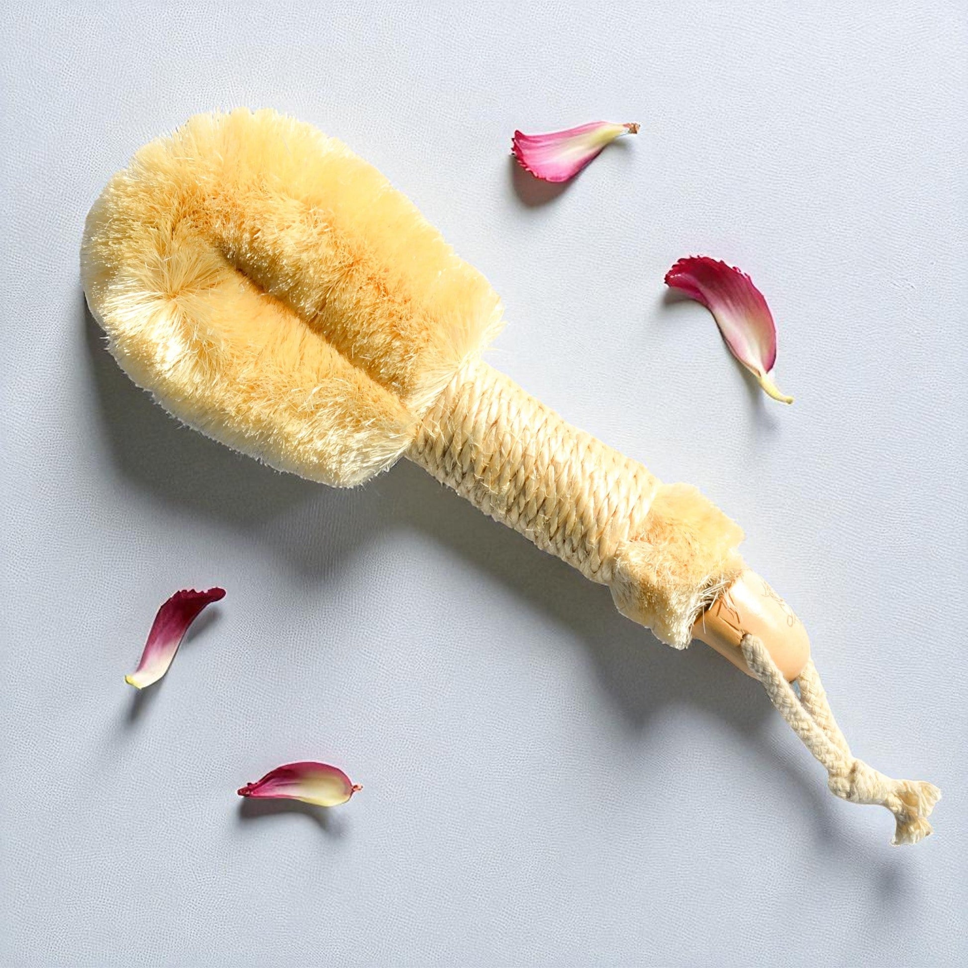 Pretty Farm Girl sisal exfoliating dry brush with wooden handle for gentle skin exfoliation and dry brushing.
