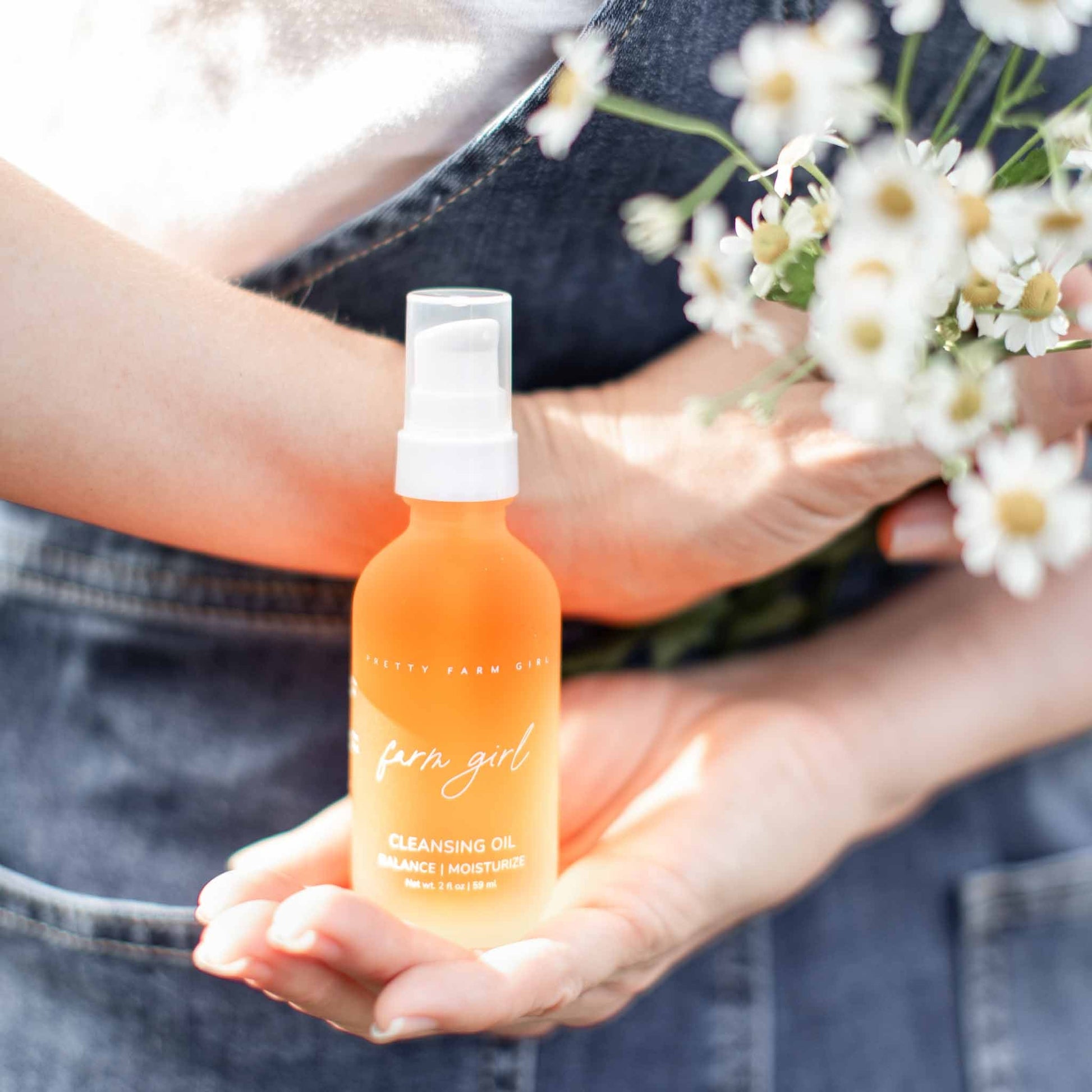 Pretty Farm Girl cleansing oil, a face cleanser in a 2 oz bottle, featuring natural ingredients and gentle skincare.
