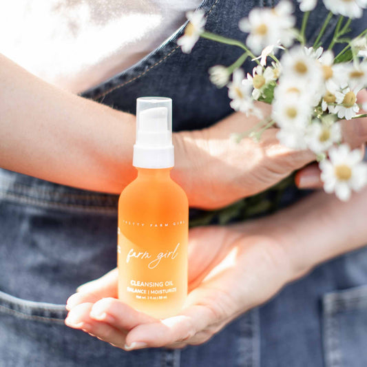 Pretty Farm Girl cleansing oil, a face cleanser in a 2 oz bottle, featuring natural ingredients and gentle skincare.