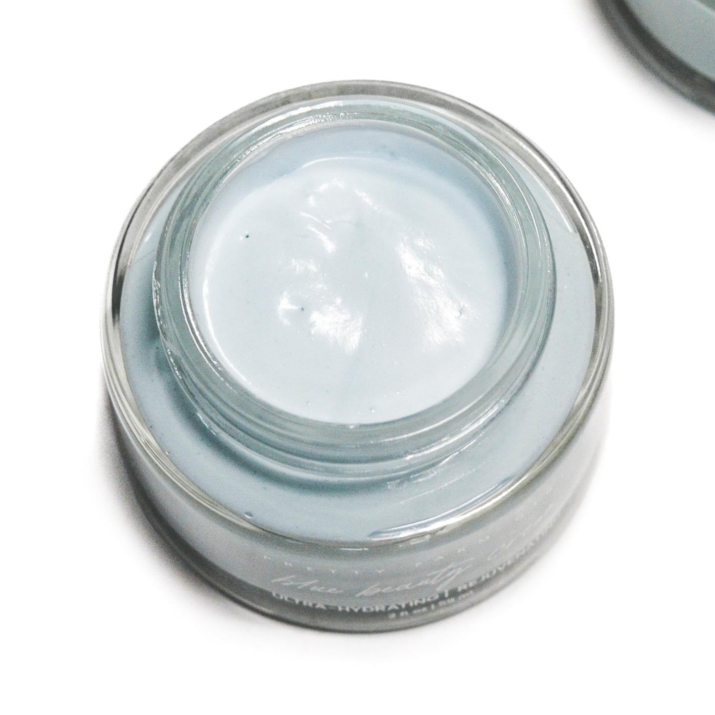 Blue Beauty Cream soothing tallow face cream by Pretty Farm Girl, shown in a jar with a smooth, creamy texture.