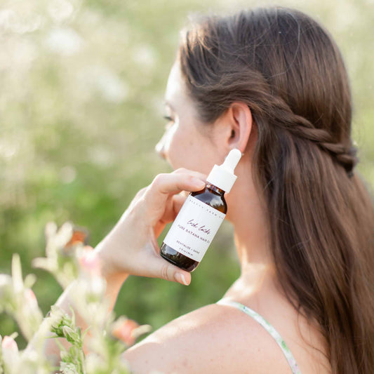 Bottle of Pretty Farm Girl Lush Locks 100% pure natural Batana hair oil for nourishing hair care and shine.