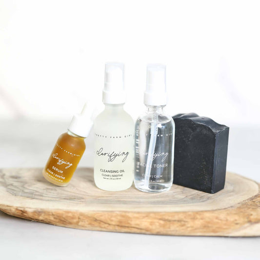 Pretty Farm Girl Clarifying Kit for Acne Prone Skin, featuring skincare products designed to reduce breakouts and clear skin.