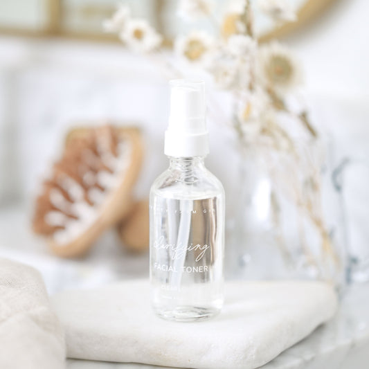 Pretty Farm Girl Clarifying Hypochlorous Acid Toner in a clear bottle, showing the toner and skincare label.