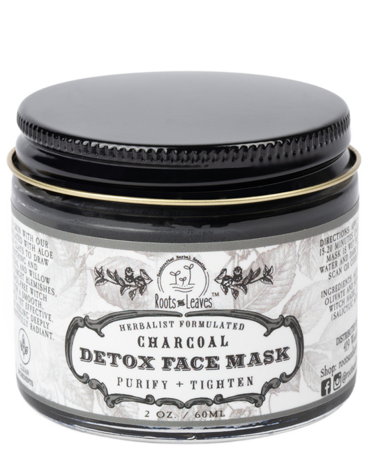 Roots and Leaves LLC Charcoal Detox Face Mask jar, showing black clay mask with natural ingredients in a clear container.