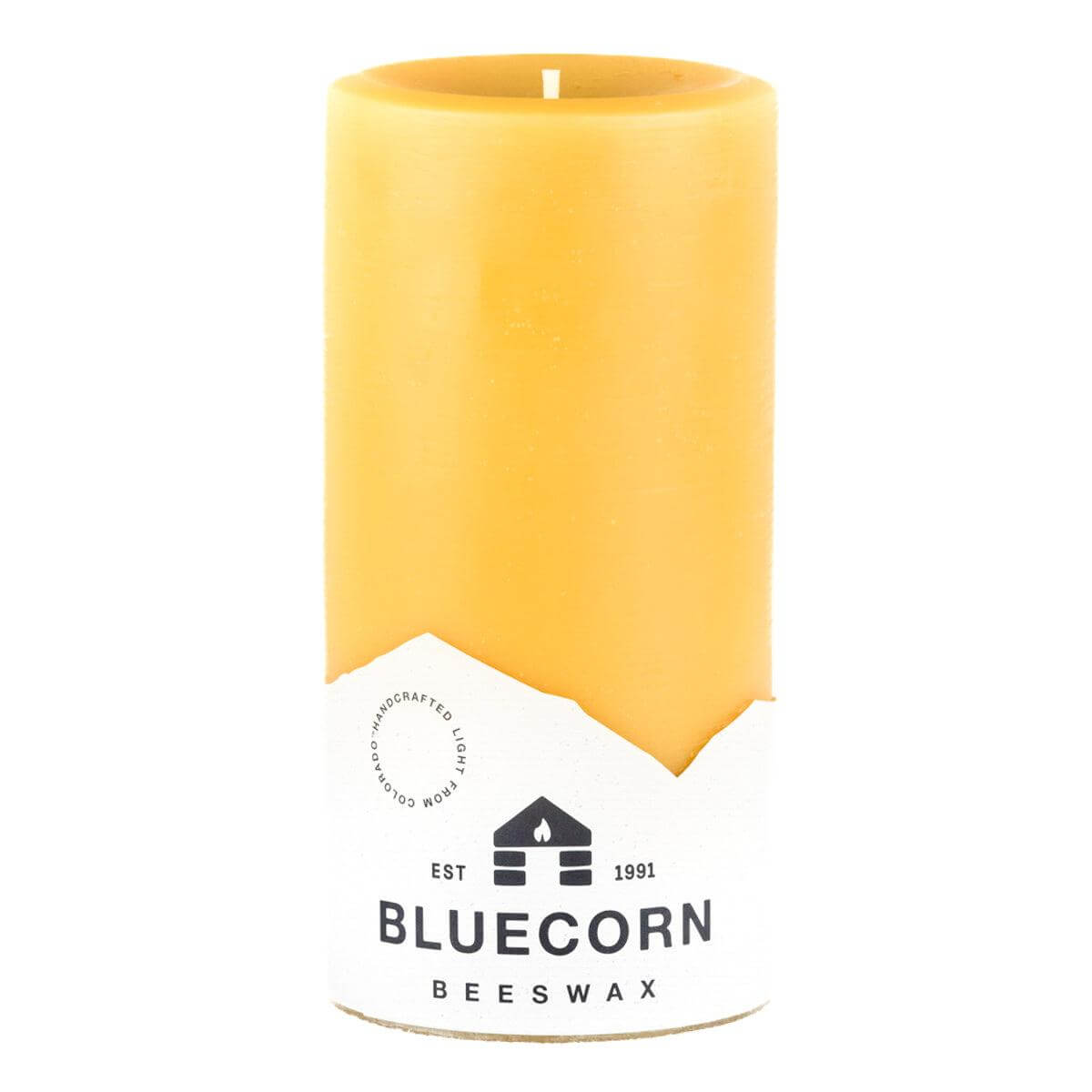 Set of three pure beeswax pillar candles by Bluecorn Candles, showing natural honey-colored wax and simple cylindrical design.