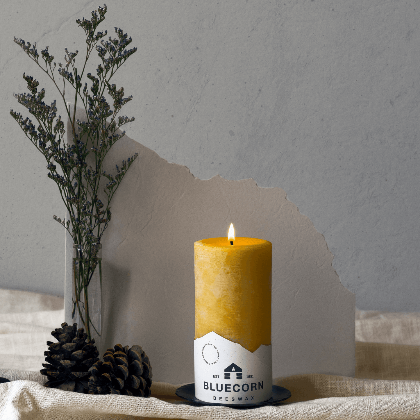 Set of blue beeswax pillar candles by Bluecorn Candles, showcasing natural, smooth-textured beeswax pillars on a clean surface.