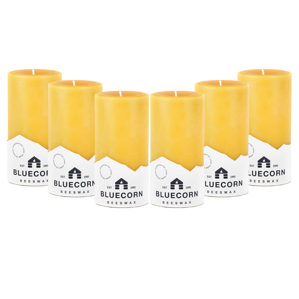 Pure beeswax pillar candles by Bluecorn Candles, natural yellow wax, tall cylindrical shape, ideal for home decor and ambient lighting.
