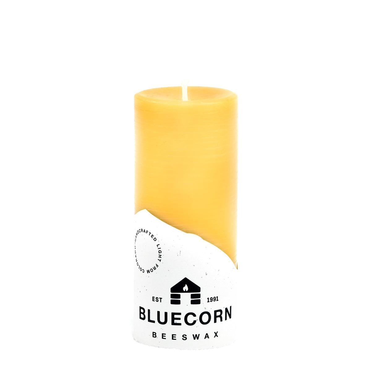 Set of four Bluecorn Candles pure beeswax pillar candles with natural, warm-colored wax and simple cylindrical design.