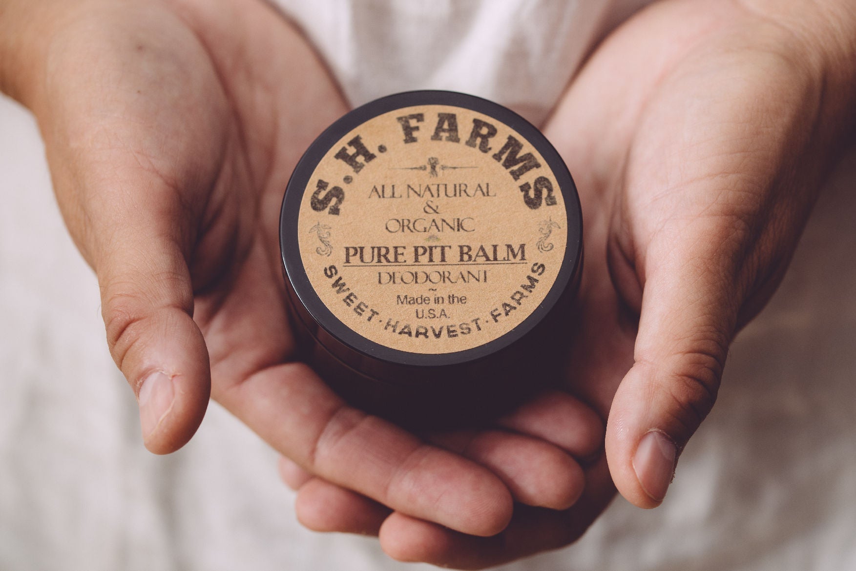 Organic Pure Pit Balm deodorant by Sweet Harvest Farms, aluminum-free natural deodorant in a balm form with a clean, eco-friendly packaging.