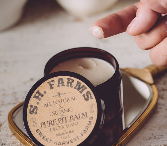 Organic Sweet Harvest Farms Pure Pit Balm Deodorant stick with natural ingredients and aluminum-free formulation.