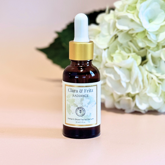 Clara & Fritz Tallow Shop Radiance Instant Glow Facial Serum bottle with clear liquid and minimalist label on a white background