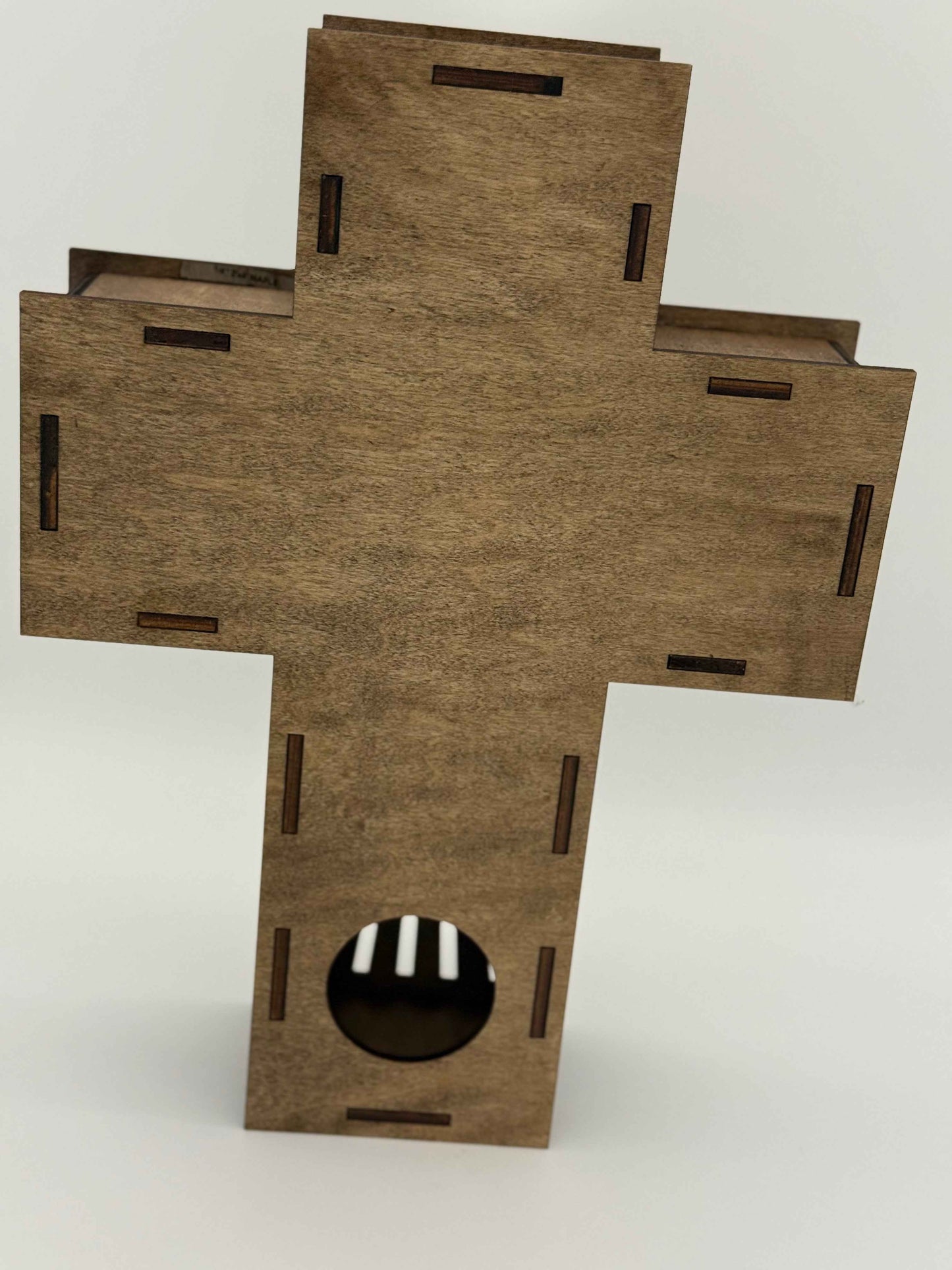 Back view of C2 Creations LLC radiant cross wall art, illuminated laser-engraved wooden spiritual decor with intricate details.