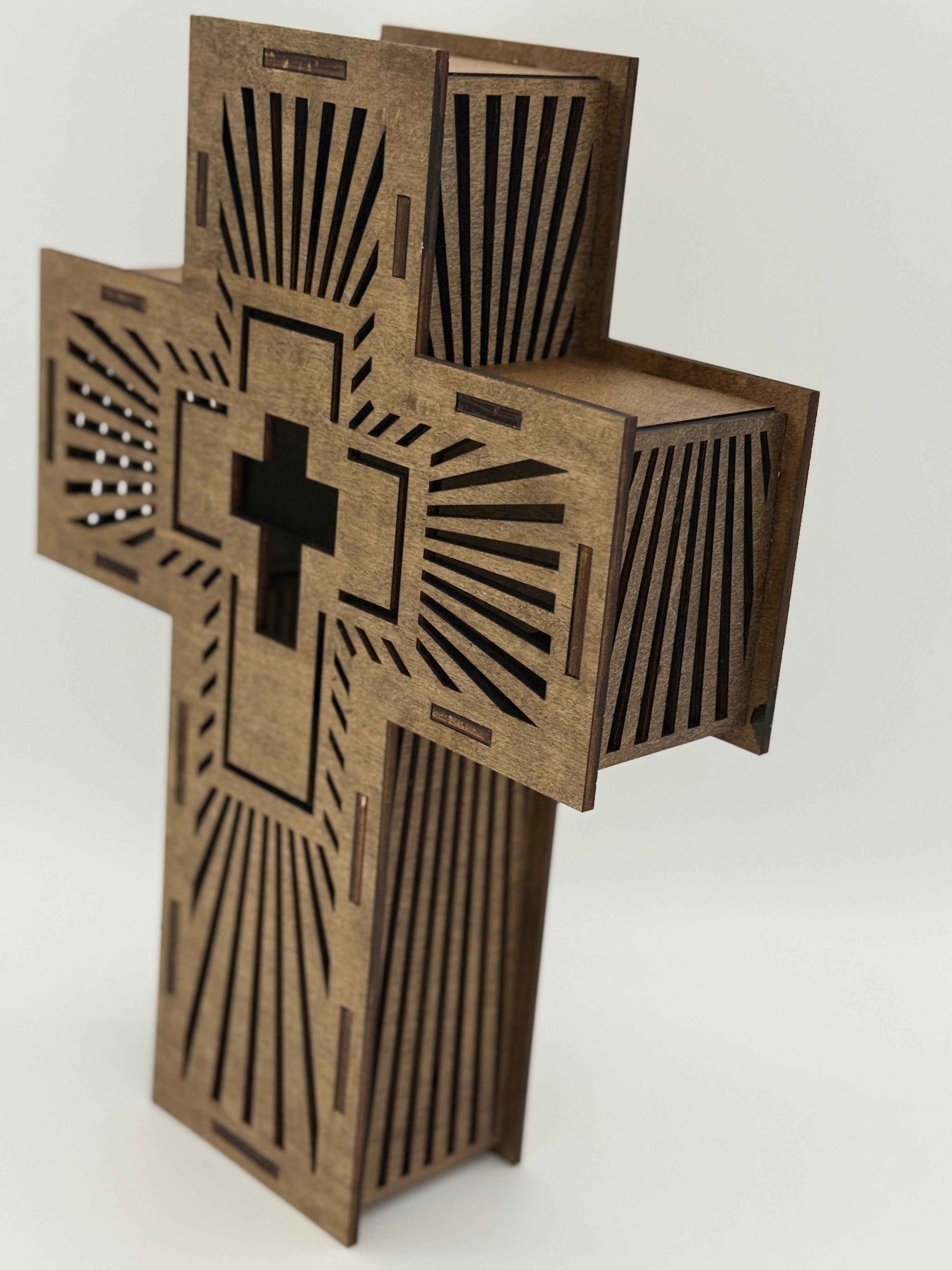 Side view of C2 Creations LLC Radiant Cross Wall Art, illuminated laser-engraved wooden spiritual decor piece.