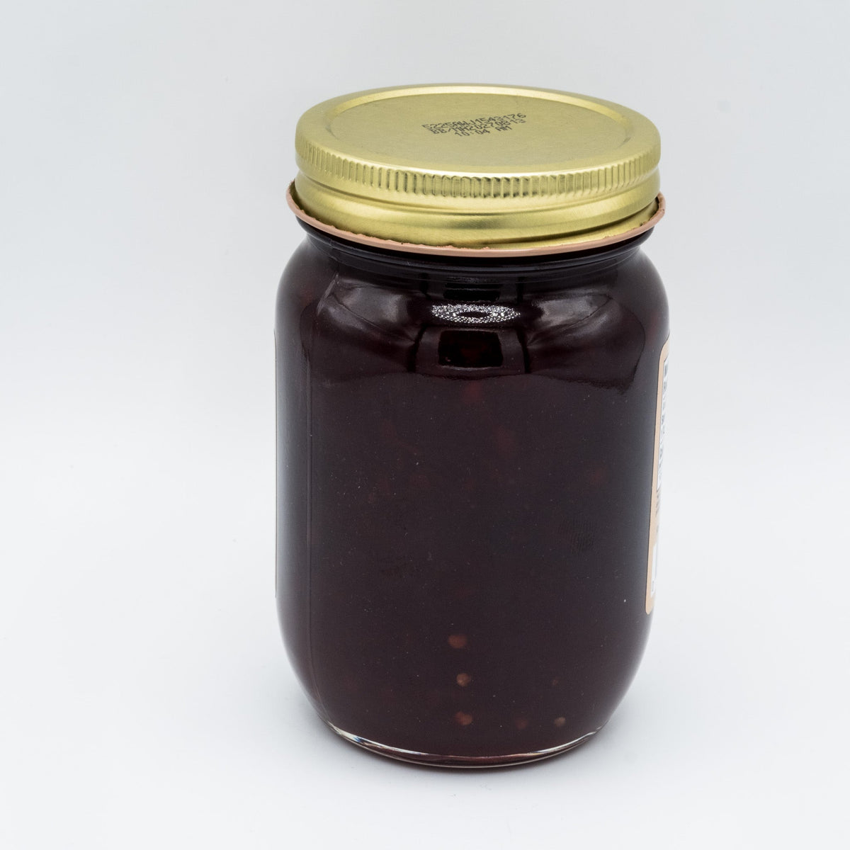 Canned Red Raspberry Seedless Jam by Amish Country Store in a jar, featuring vibrant red jam with no seeds, 18oz container.