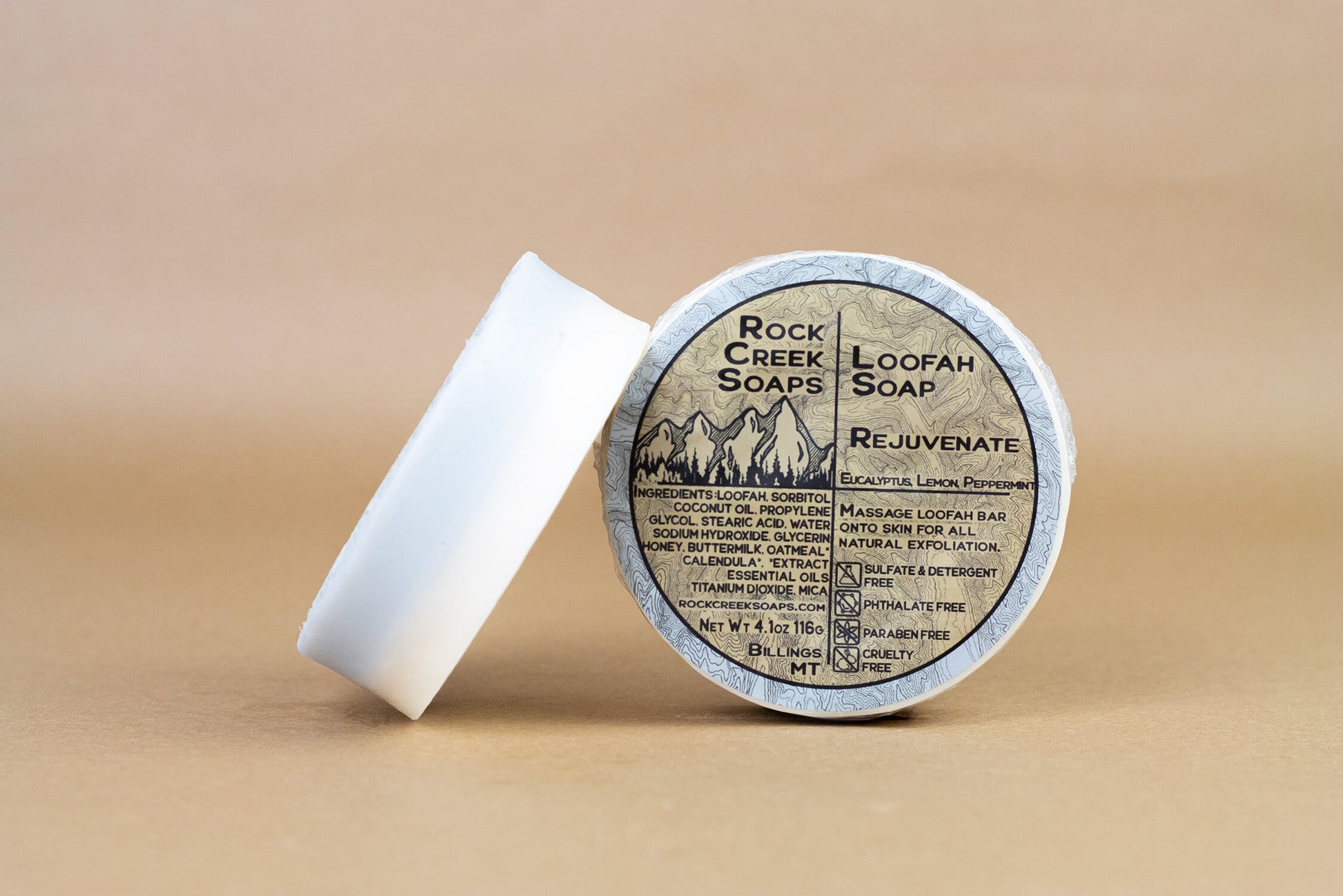 Rock Creek Soaps Rejuvenate Loofah Soap with natural loofah exfoliant, showcasing the soap's textured surface and rejuvenating design.