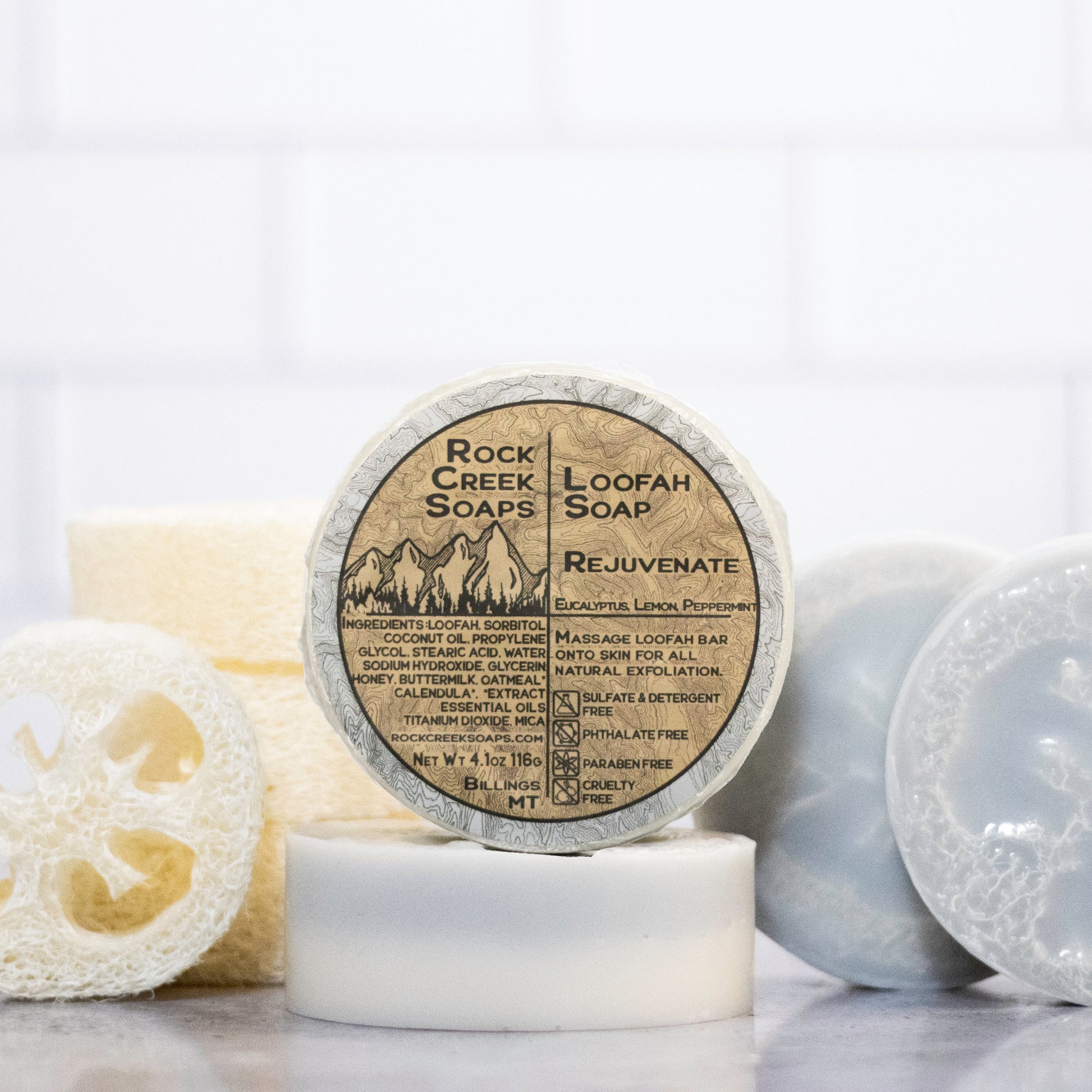 Rock Creek Soaps rejuvenating loofah soap with natural exfoliating loofah and gentle cleansing formula in a clear bar