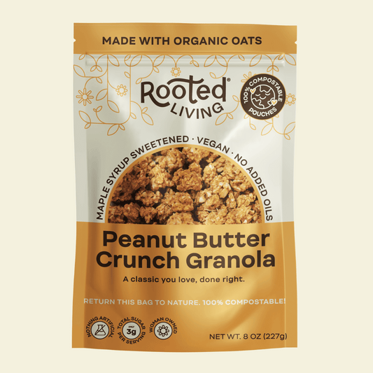 Canned peanut butter crunch granola by Rooted Living in a sealed metal can, showing the product label and packaging.