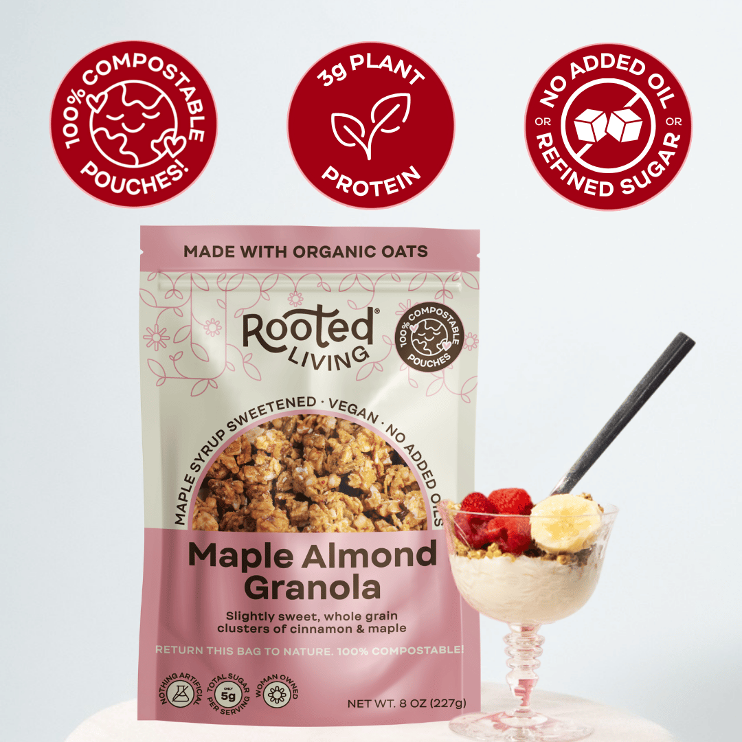 Rooted Living Maple Almond Granola in a bowl with almonds and oats, showcasing the crunchy, golden granola texture.