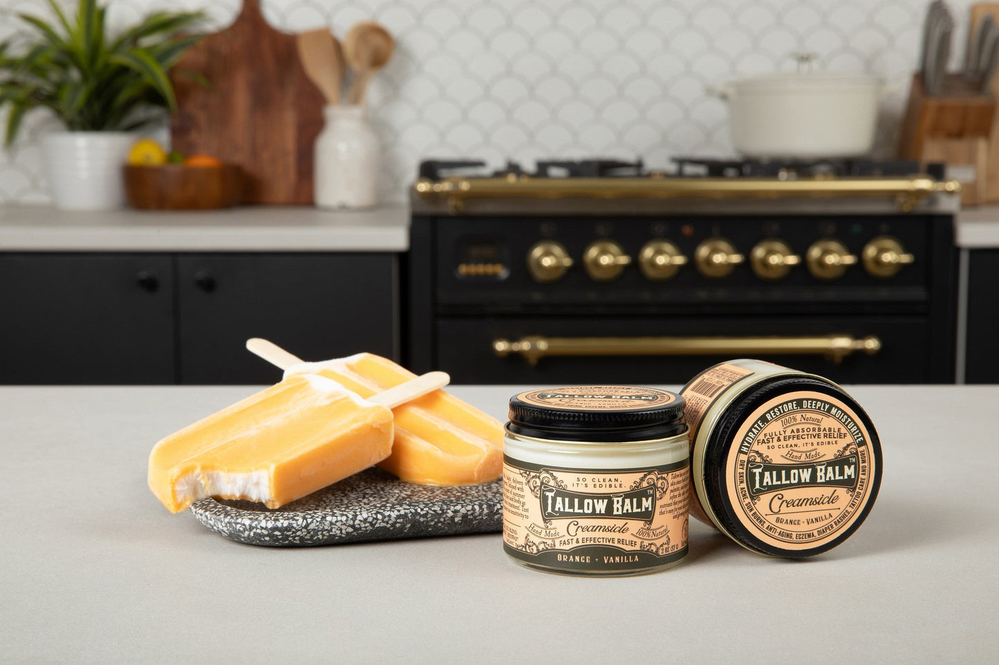 Tallow balm from Roots and Leaves LLC with a creamsicle scent, showing a jar of nourishing skincare balm on a natural background.
