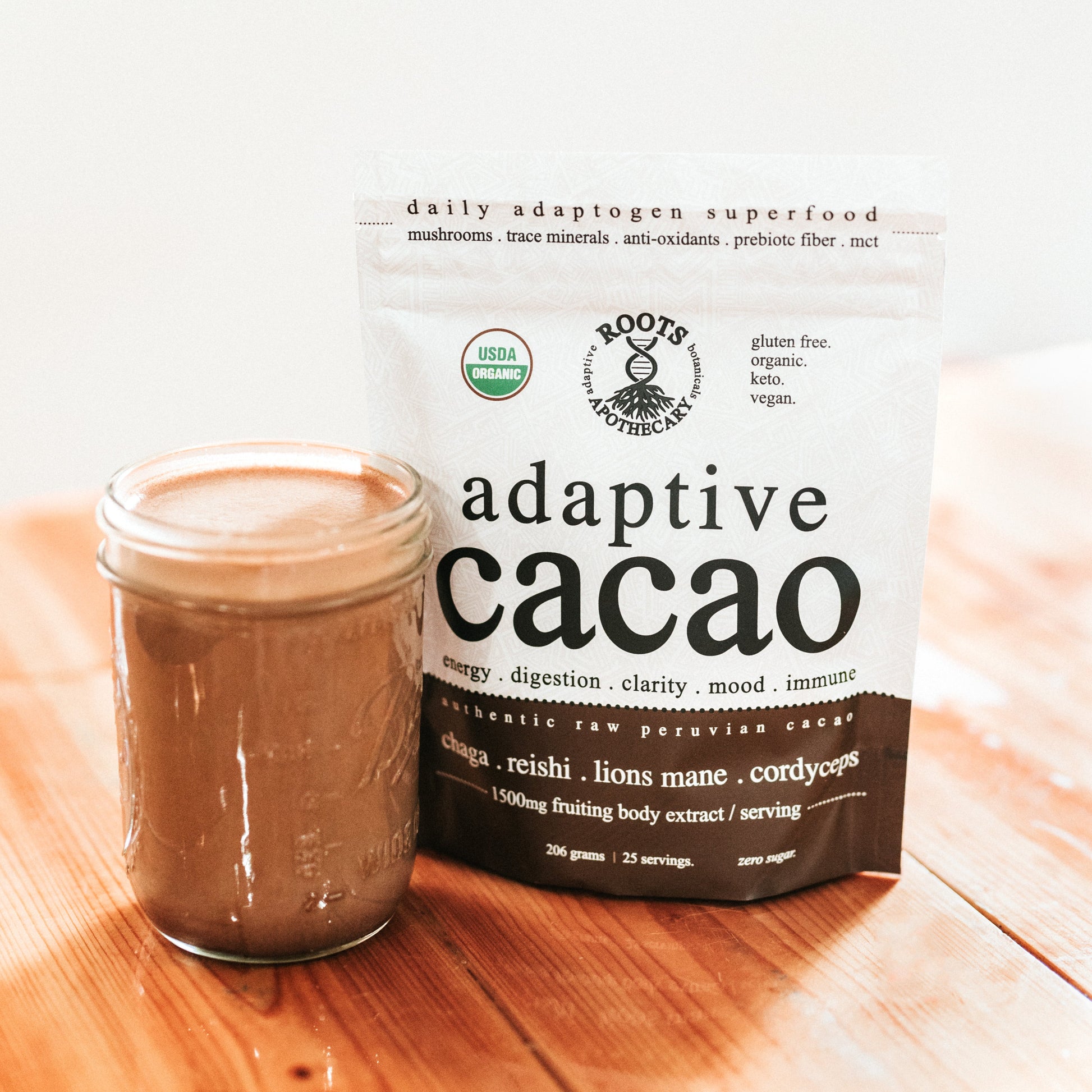 Root Apothecary Adaptive Cacao superfood in a jar, featuring 30 servings of performance-enhancing cacao powder.