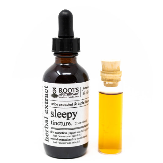 Roots Apothecary sleepy tincture bottle with dropper, herbal tincture for relaxation and sleep support.