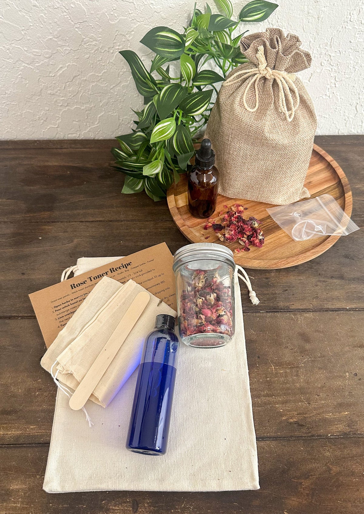 Herbalroseapothecary DIY Rose Toner Kit with natural ingredients, glass bottles, and botanical labels for skincare at home.