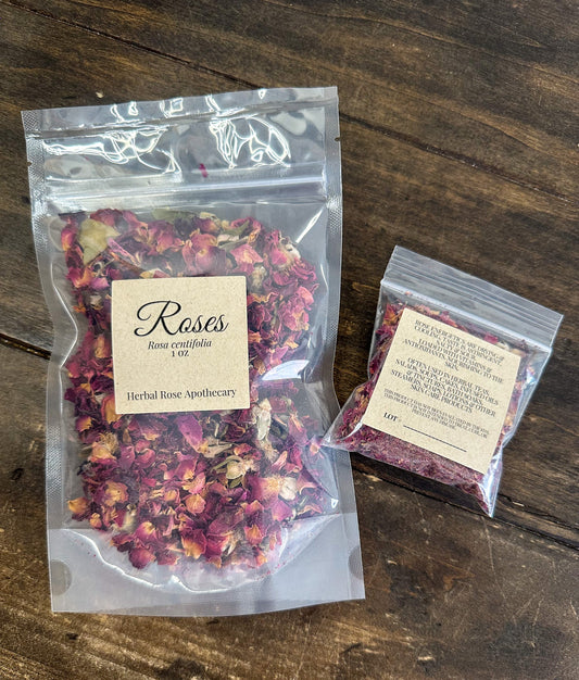 Fresh herbalroseapothecary rose petals scattered in a natural arrangement, showcasing vibrant pink and red flower petals.