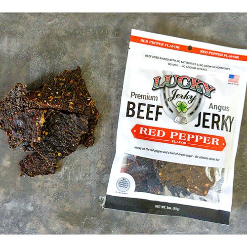 3 oz of Red Pepper Beef Jerky from Nebraska Star Beef showing sliced, seasoned beef jerky with red pepper flakes on a plate.