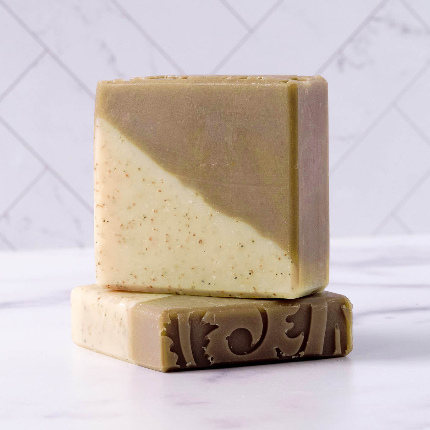 Rustic Strength sandalwood patchouli bar soap, 2.5 oz, with earthy scent and natural ingredients, displayed on a neutral background.
