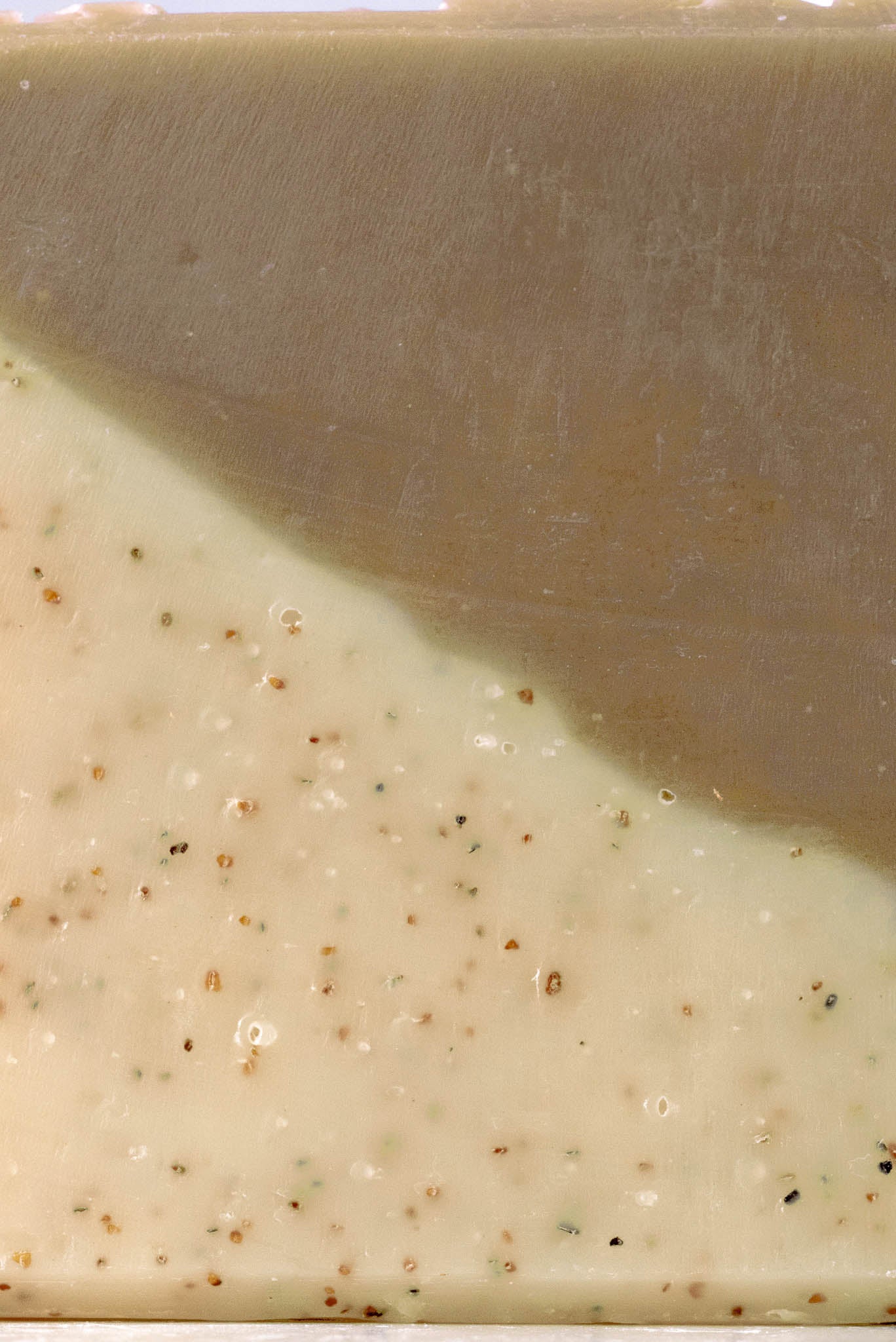 Rustic Strength sandalwood and patchouli scented bar soap with natural ingredients, 2.5 oz, showcasing a rustic soap bar.