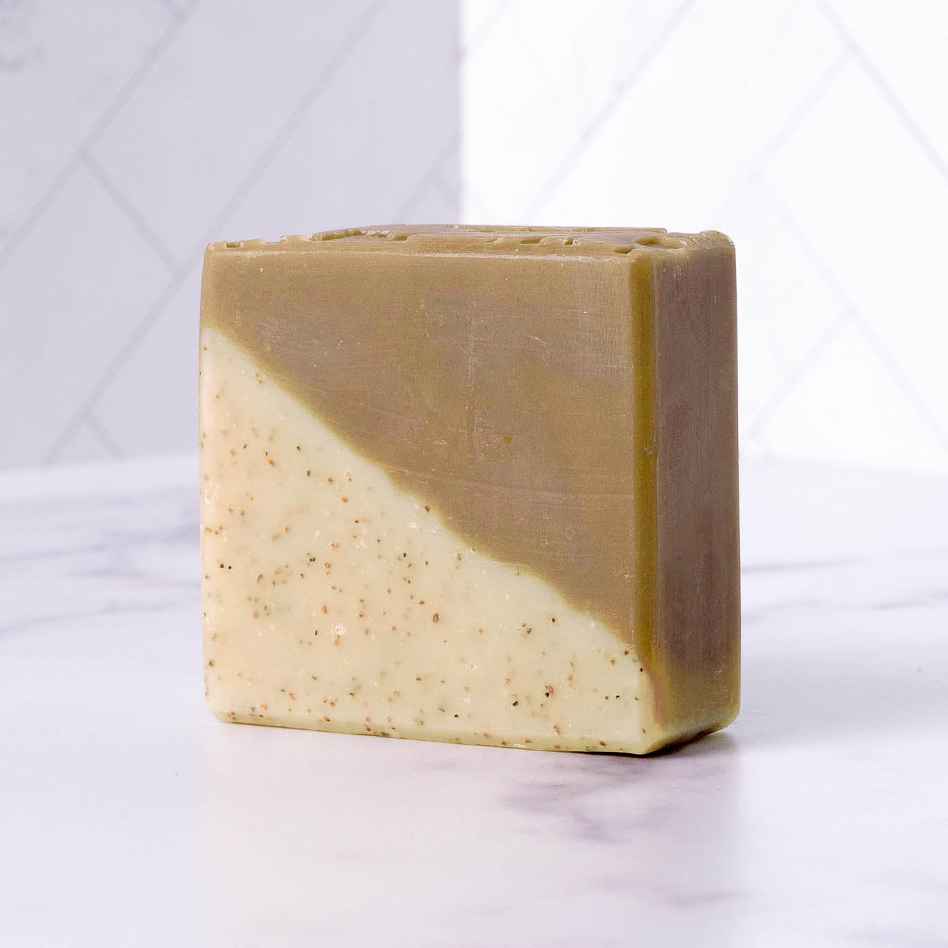 Rustic Strength sandalwood patchouli bar soap showing a 2.5 oz natural soap bar with earthy scent and rustic packaging