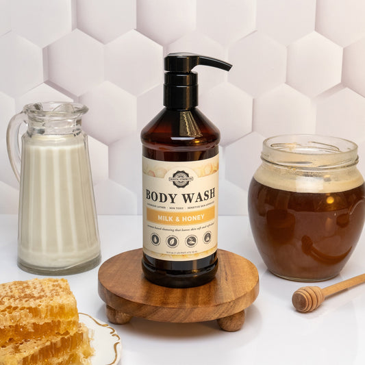 Rustic Strength Milk & Honey moisturizing body wash in a 16 oz plastic bottle for gentle cleansing and hydration.