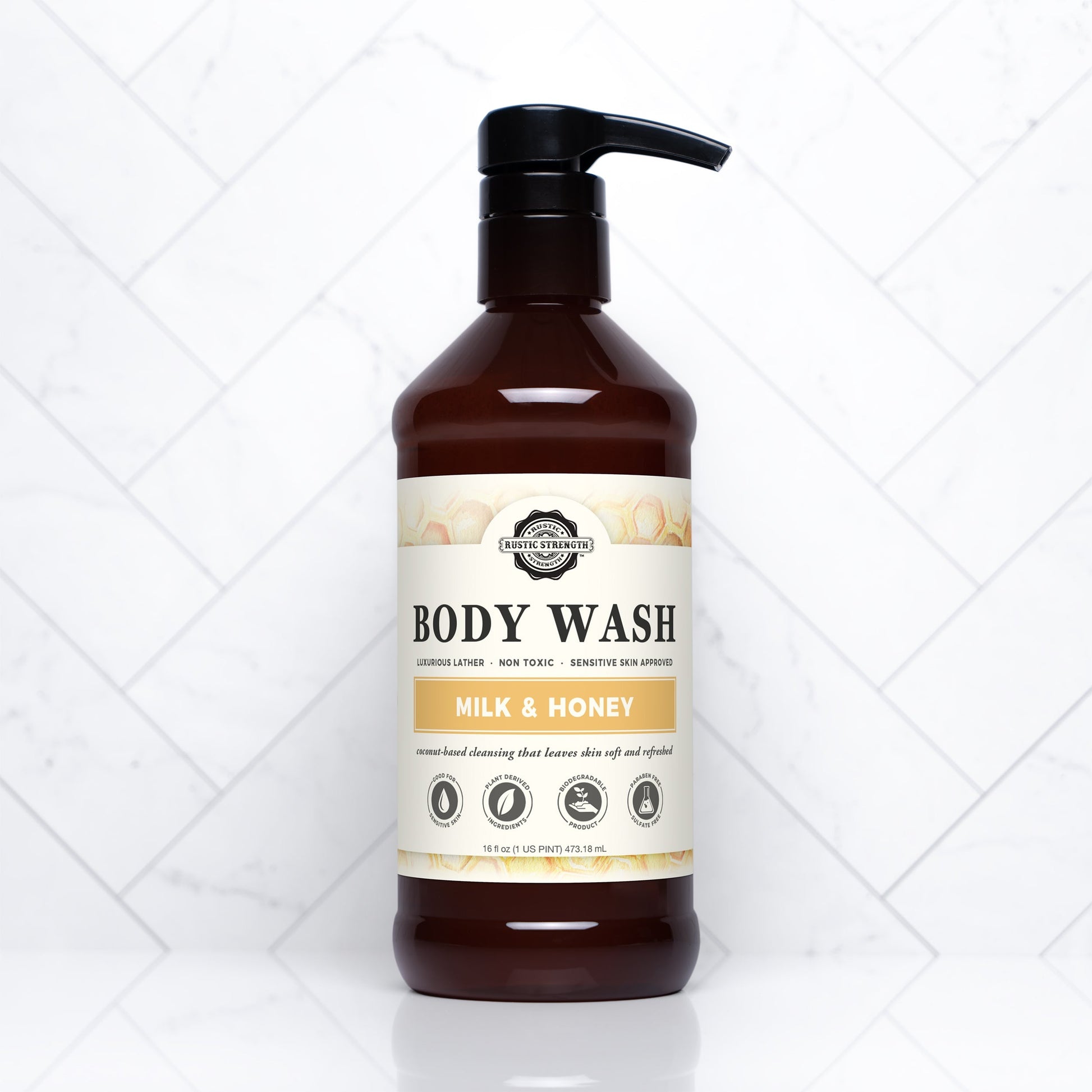 Rustic Strength Milk & Honey Moisturizing Body Wash in a 16 oz bottle, featuring a gentle, nourishing formula for soft skin.