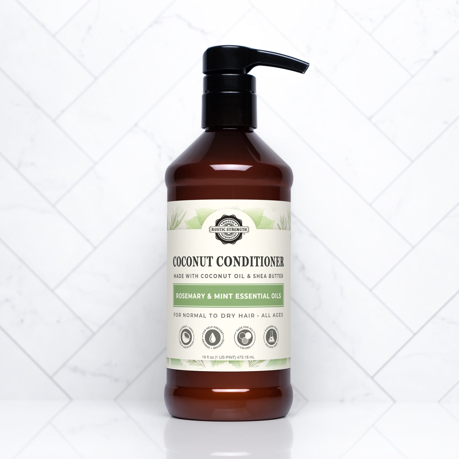 Rustic Strength Coconut Conditioner with rosemary and mint in a 16 oz bottle, showing the conditioner's creamy texture.