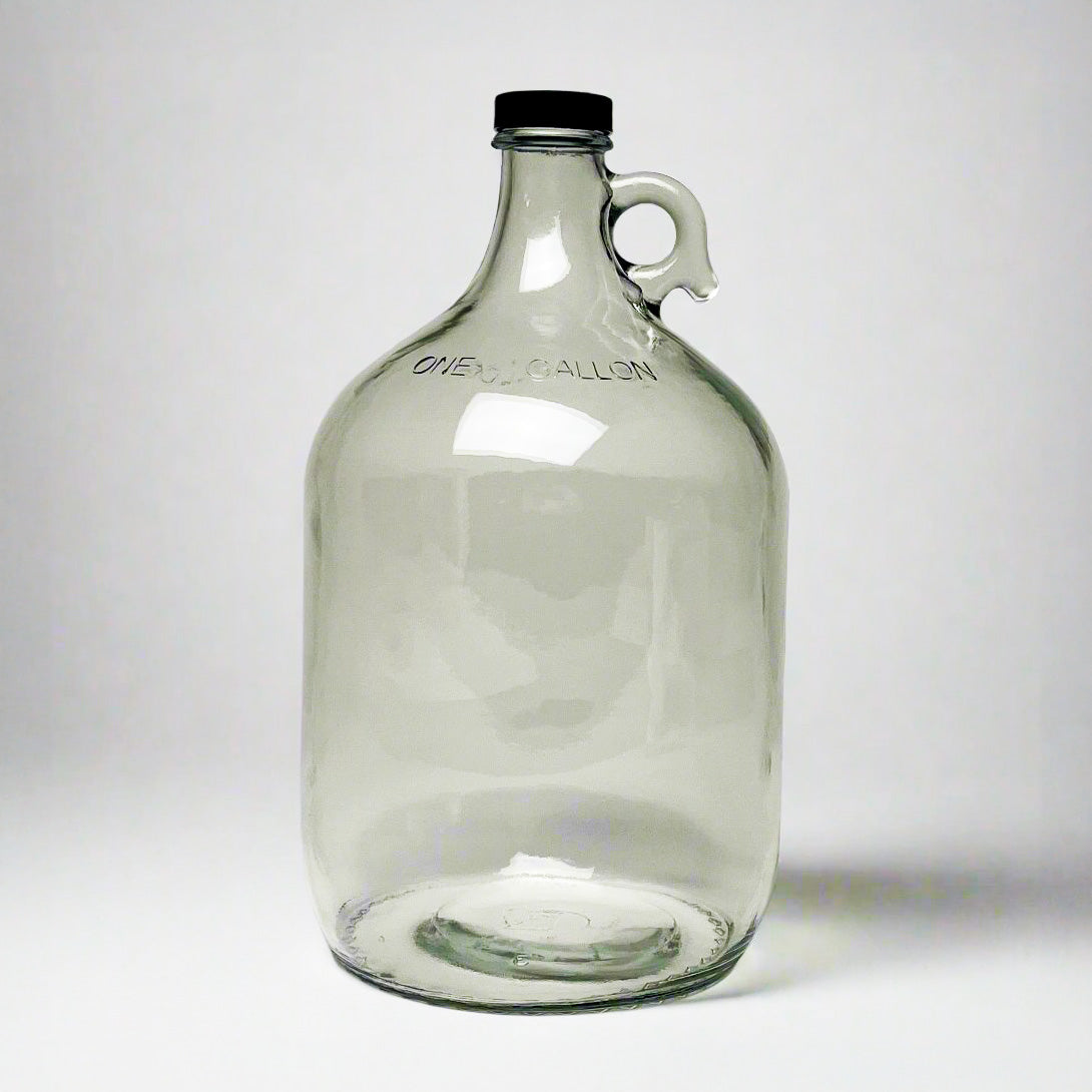 1-gallon glass jug with cap by Rustic Strength, featuring a clear glass container with a secure lid for liquid storage.