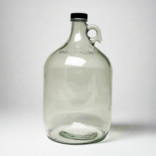 1-gallon glass jug with cap by Rustic Strength, featuring a clear glass container with a secure lid for liquid storage.