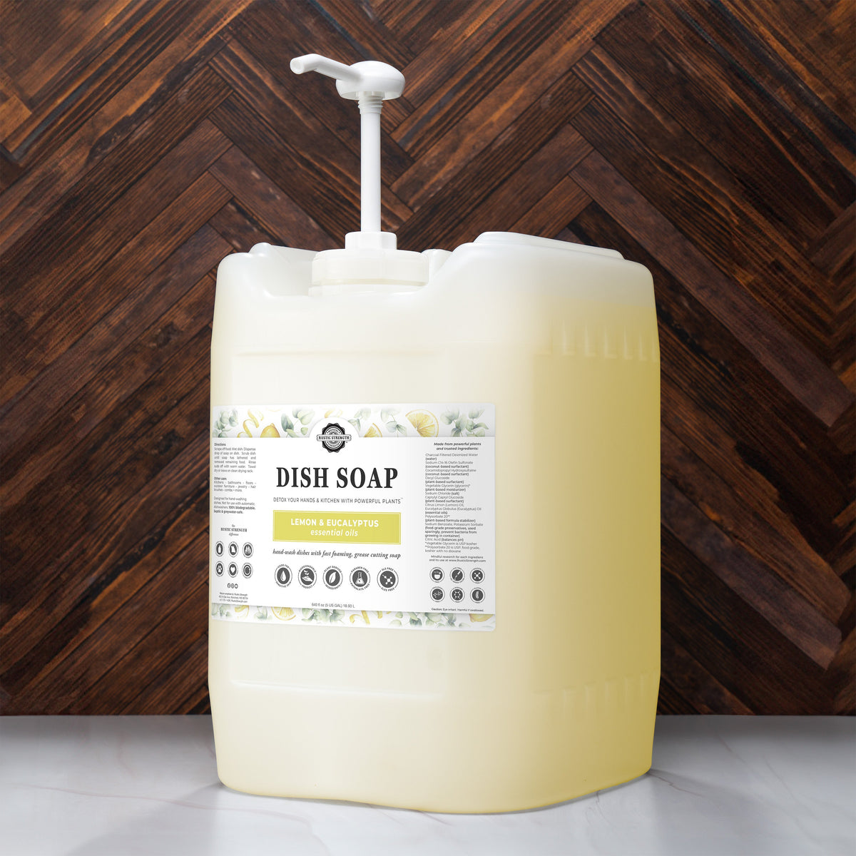 Rustic Strength lemon and eucalyptus dish soap in a 16 oz plastic bottle, with lemon and eucalyptus scent and label visible.