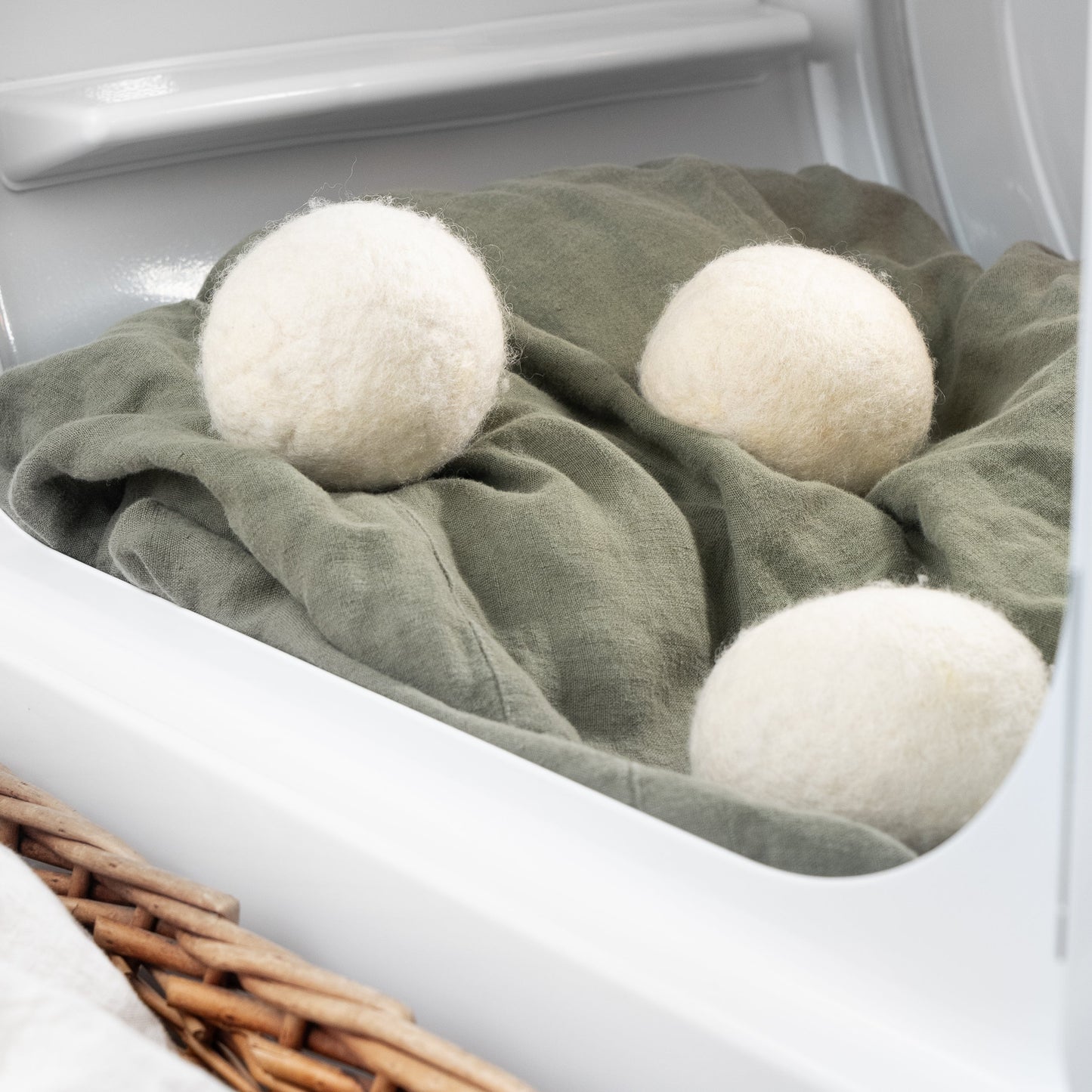 Three large Rustic Strength jumbo wool dryer balls in a 3-pack, used for softening clothes and reducing drying time.